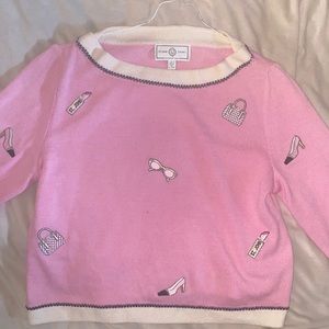 A pink sweater made by St. John sport by Marie Gray